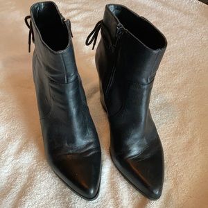 Black leather booties with back bow